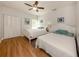 Two twin beds in a well-lit guest bedroom at 4819 Greenleaf Rd, Sarasota, FL 34233