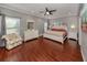 Spacious main bedroom with wood floors and ensuite bathroom at 4819 Greenleaf Rd, Sarasota, FL 34233