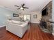 Living room with hardwood floors, fireplace, and large windows at 4819 Greenleaf Rd, Sarasota, FL 34233