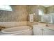 Relaxing bathroom with soaking tub, shower, and updated fixtures at 4881 Flagstone Dr, Sarasota, FL 34238