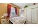 Comfortable bedroom with a double bed and built in closet at 4881 Flagstone Dr, Sarasota, FL 34238