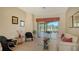 Gathering room featuring a comfortable seating area and access to a lanai at 4881 Flagstone Dr, Sarasota, FL 34238