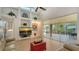 Light and airy living room with hardwood floors, large windows, and access to the patio at 4881 Flagstone Dr, Sarasota, FL 34238