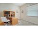 Functional home office with built-in desk and cabinetry at 4881 Flagstone Dr, Sarasota, FL 34238