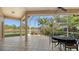 Relaxing screened patio with canal view, perfect for outdoor dining at 4881 Flagstone Dr, Sarasota, FL 34238