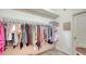 Large walk-in closet with ample hanging and shelving space at 4881 Flagstone Dr, Sarasota, FL 34238