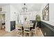 Dining room featuring a farmhouse table, black and white wainscoting, and light floors at 510 45Th E St, Bradenton, FL 34208