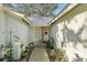 Front entry with walkway, potted plants, and a wreath on the door at 510 45Th E St, Bradenton, FL 34208