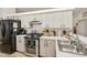 Modern kitchen with stainless steel appliances and light wood cabinets at 510 45Th E St, Bradenton, FL 34208