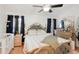 Main bedroom featuring a king-size bed and ample dresser space at 510 45Th E St, Bradenton, FL 34208