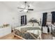 Spacious main bedroom with king-size bed and crib at 510 45Th E St, Bradenton, FL 34208