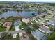 Aerial view of home near lake in residential neighborhood at 5154 51St W Ln, Bradenton, FL 34210