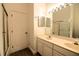 Bathroom with double sinks, updated vanity, and a large mirror at 5154 51St W Ln, Bradenton, FL 34210