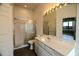 Clean bathroom with a shower, toilet and vanity with a large mirror at 5154 51St W Ln, Bradenton, FL 34210