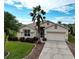 One-story home with a landscaped yard and a two-car garage at 5154 51St W Ln, Bradenton, FL 34210