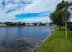 Peaceful lakefront view with homes and green space at 5154 51St W Ln, Bradenton, FL 34210