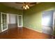 Home office with wood flooring and French doors leading to another room at 5154 51St W Ln, Bradenton, FL 34210