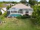 Home with screened in pool and lush landscaping at 5154 51St W Ln, Bradenton, FL 34210