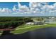 Aerial view of park with lake, walking paths, and playground at 5432 Hampstead Heath # 26, Sarasota, FL 34235