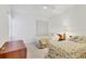 Bedroom with twin beds and floral bedding at 5432 Hampstead Heath # 26, Sarasota, FL 34235