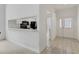 Bright entryway with view of kitchen and access to other rooms at 5432 Hampstead Heath # 26, Sarasota, FL 34235