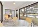 Sunroom with water view and yellow chairs at 5432 Hampstead Heath # 26, Sarasota, FL 34235