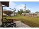 Backyard with patio, grassy area, and mature trees at 5506 3Rd Avenue W Plz, Bradenton, FL 34209