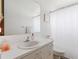 Simple bathroom with white vanity and shower/tub combo at 5506 3Rd Avenue W Plz, Bradenton, FL 34209