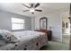 Comfortable bedroom with a dresser and large window offering natural light at 5506 3Rd Avenue W Plz, Bradenton, FL 34209