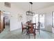 Bright dining room with wood table and chairs, leading to a view of the patio at 5506 3Rd Avenue W Plz, Bradenton, FL 34209