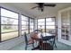 Bright sunroom with a round wooden table and four chairs at 5506 3Rd Avenue W Plz, Bradenton, FL 34209