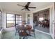 Bright sunroom features a table and chairs, perfect for dining at 5506 3Rd Avenue W Plz, Bradenton, FL 34209