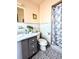 Bathroom with gray vanity and shower/tub combo at 5507 28Th W St, Bradenton, FL 34207