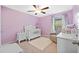 Bedroom with crib, dresser, and armchair at 5546 Appleton Shore Dr, Apollo Beach, FL 33572