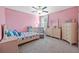 Charming bedroom with a crib and dresser at 5546 Appleton Shore Dr, Apollo Beach, FL 33572