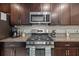 Stainless steel appliances and granite countertops in a modern kitchen at 5546 Appleton Shore Dr, Apollo Beach, FL 33572