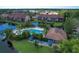 Aerial view of community pool, shuffleboard, and condos at 5671 Ashton Lake Dr # 3, Sarasota, FL 34231