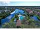 Aerial view of community with lake and pool at 5671 Ashton Lake Dr # 3, Sarasota, FL 34231