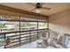 Screened balcony with patio furniture and community view at 5671 Ashton Lake Dr # 3, Sarasota, FL 34231