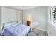 Bedroom with a Murphy bed and built-in shelving at 5671 Ashton Lake Dr # 3, Sarasota, FL 34231