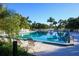 Refreshing community swimming pool with lounge chairs at 5671 Ashton Lake Dr # 3, Sarasota, FL 34231