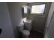 Updated bathroom with toilet, vanity, and medicine cabinet at 5893 Welcome Rd # I-7, Bradenton, FL 34207