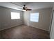 Bedroom with ceiling fan and wood-look floors at 5893 Welcome Rd # I-7, Bradenton, FL 34207