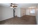 Living room with ceiling fan and wood-look floors at 5893 Welcome Rd # I-7, Bradenton, FL 34207