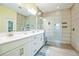 Spa-like bathroom with double vanity and large walk-in shower at 5914 Fiore Dr, Bradenton, FL 34208