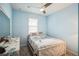 Light blue bedroom with a full-size bed and window shutters at 5914 Fiore Dr, Bradenton, FL 34208