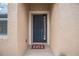 Navy blue front door with a storm door and welcome mat at 5914 Fiore Dr, Bradenton, FL 34208