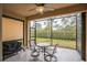 Screened patio with outdoor furniture and a Blackstone grill at 5914 Fiore Dr, Bradenton, FL 34208