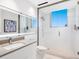 Modern bathroom with a glass shower, floating vanity, and neutral color palette at 6100 Midnight Pass Rd # 401, Sarasota, FL 34242