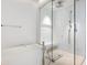 Modern bathroom featuring a glass shower, soaking tub, and neutral color palette at 6100 Midnight Pass Rd # 401, Sarasota, FL 34242